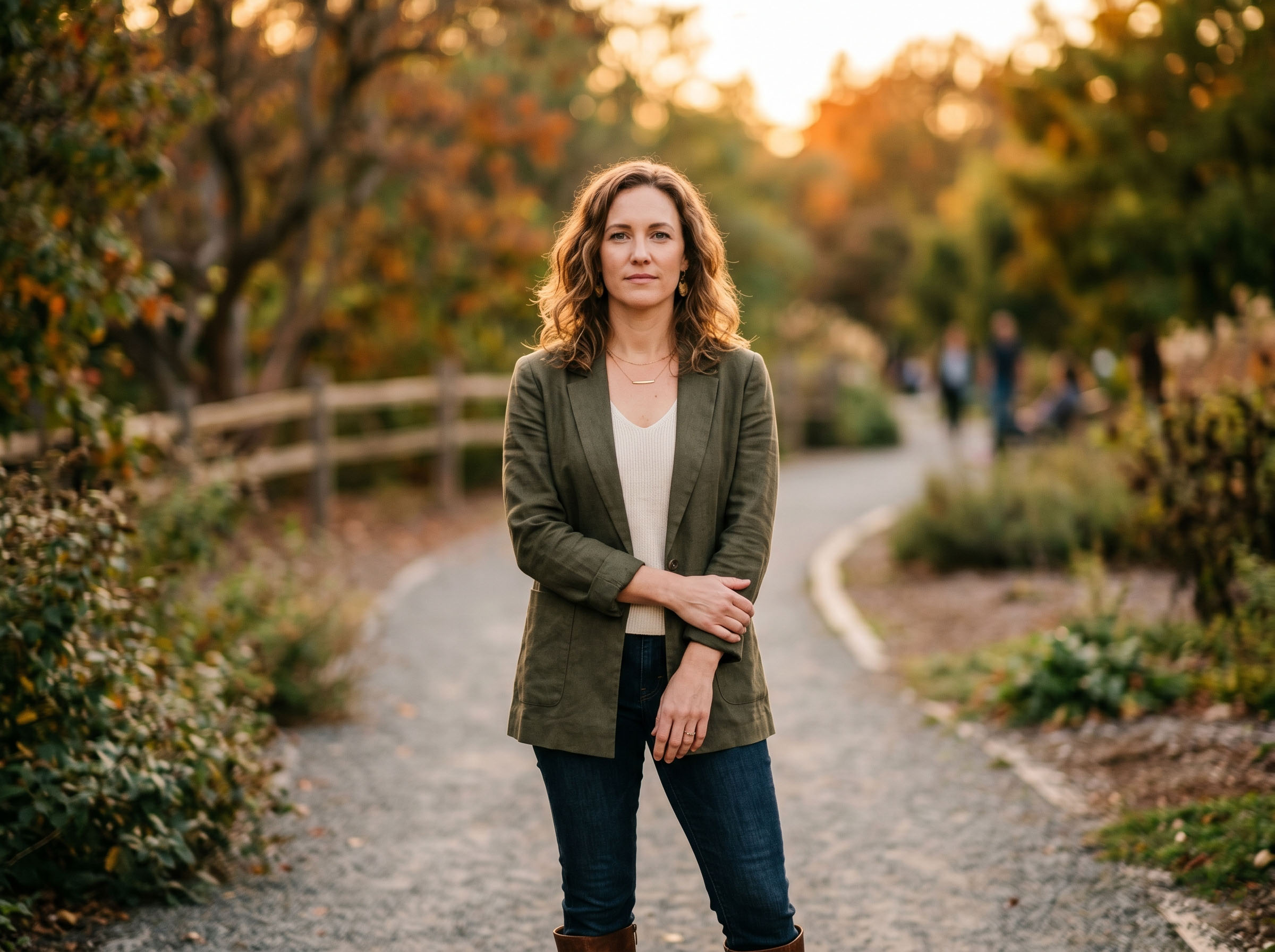 Woman standing confidently in natural light, looking forward with clarity and calm