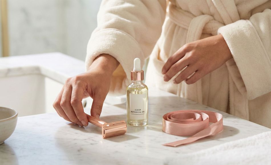 Elegant shaving tools and soothing oils for women's intimate grooming.