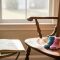 A chair with socks and a note of I will miss you by a window, reflecting on pregnancy loss