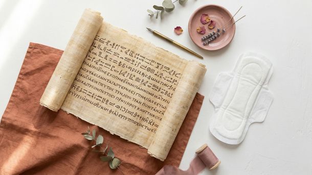 A papyrus scroll and calendar representing the history of the monthly cycle through the ages