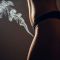 Silhouette of a woman’s lower torso with a plume of smoke rising — conceptual photo for an editorial on strange body practices.