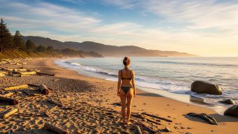 A peaceful naturist beach with travelers enjoying the sun in a relaxed, mindful atmosphere.