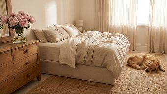 A minimalist and elegant master bedroom reflecting traditional feminine aesthetics.