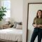 Woman reflecting on body image and self-perception in a thoughtful moment